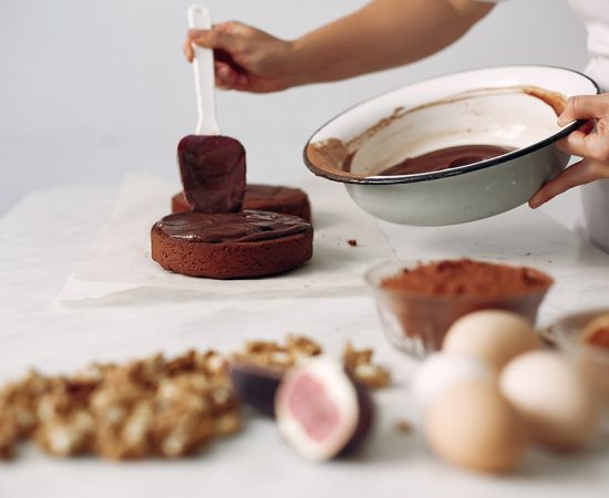 Lady is preparing dessert.Woman bakes a cake.